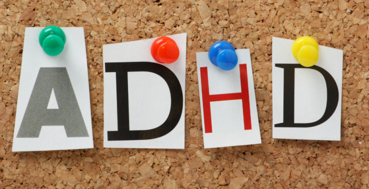 Letters A, D, H, D pinned to a notice board