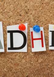Letters A, D, H, D pinned to a notice board