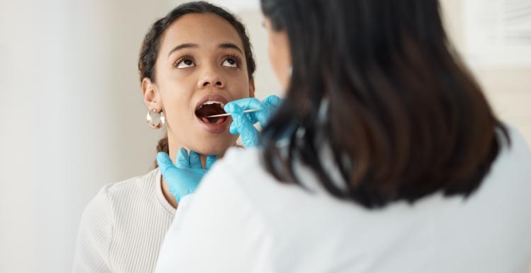 Young girl getting her teeth checked by a dentist