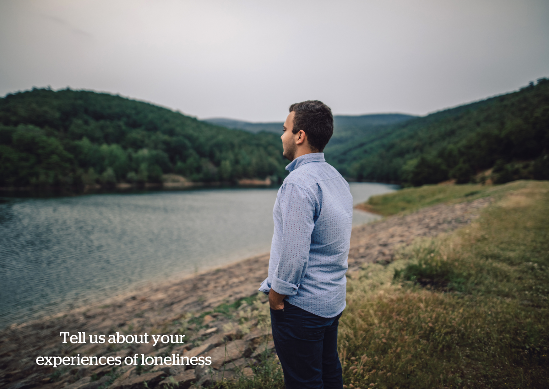 Man looking longingly out over the water