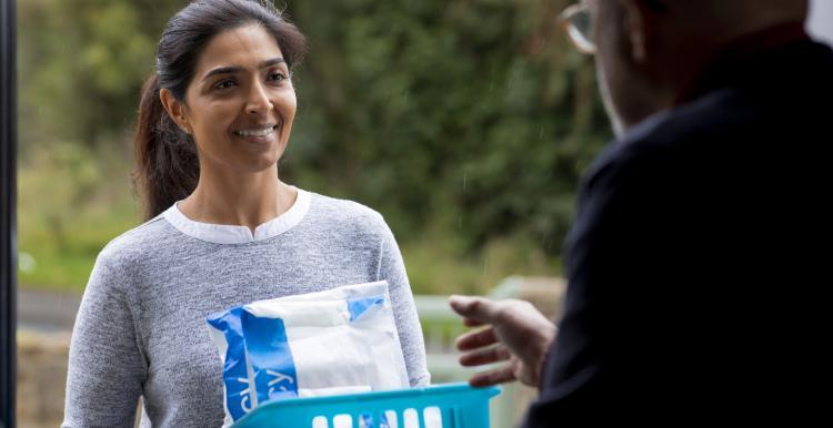 Lady delivering a prescription to someone at home