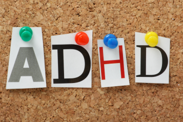 Letters A, D, H, D pinned to a notice board