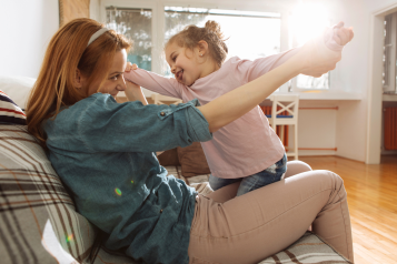 Mother playing with her daughter