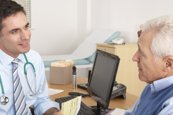 Male doctor and male patient talking