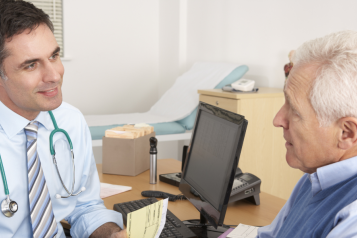 Male doctor and male patient talking 