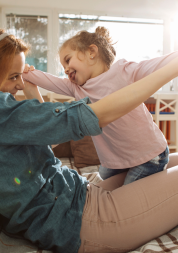 Mother playing with her daughter